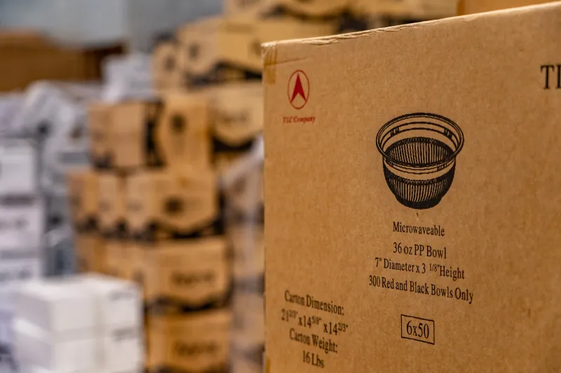 Case of 36oz microwaveable PP bowls sitting on the wholesale pickup floor